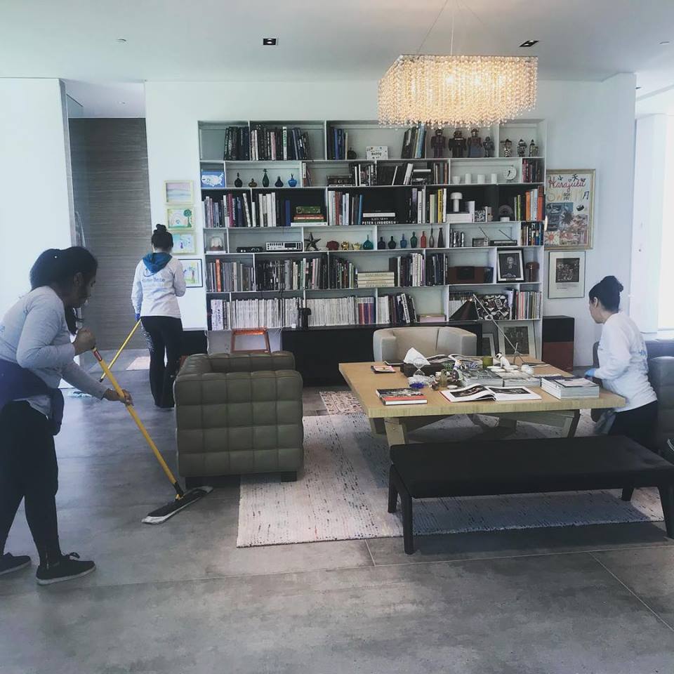Residential living room cleaning crew after construction project